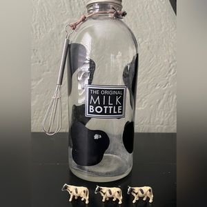 The original milk bottle with whisk and three rubber cows.